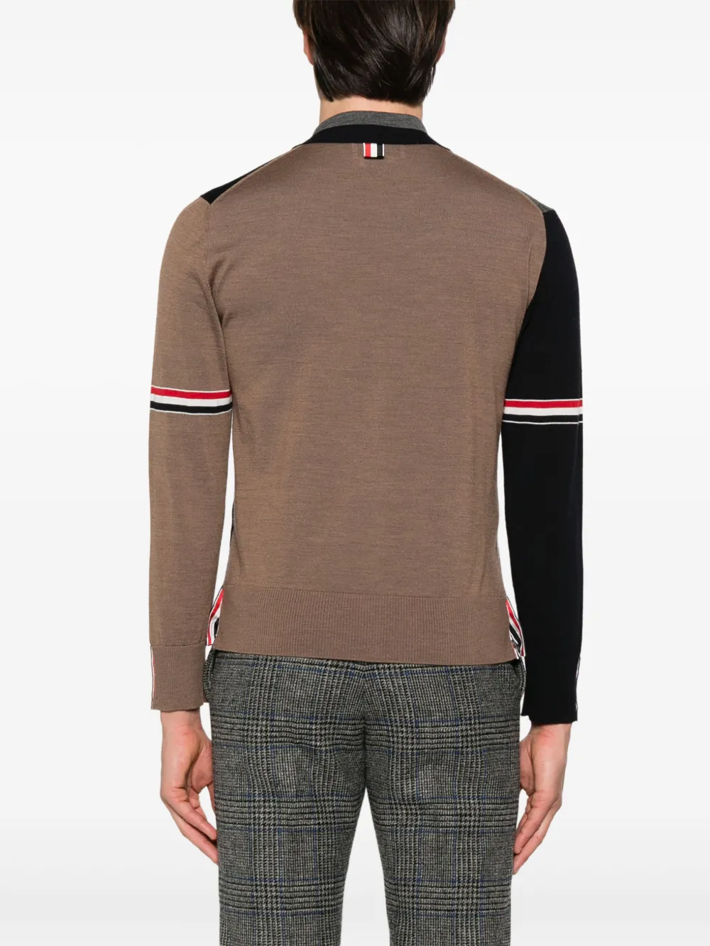 Blue knitwear worn by a person, showing the knitwear's fit