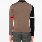 Blue knitwear worn by a person, showing the knitwear's fit