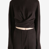 brown sweater worn by a person, showing the sweater fit