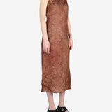 Brown dress worn by a person, showing the dress's fit