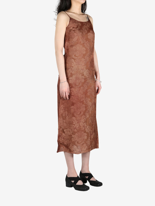 Brown dress worn by a person, showing the dress's fit