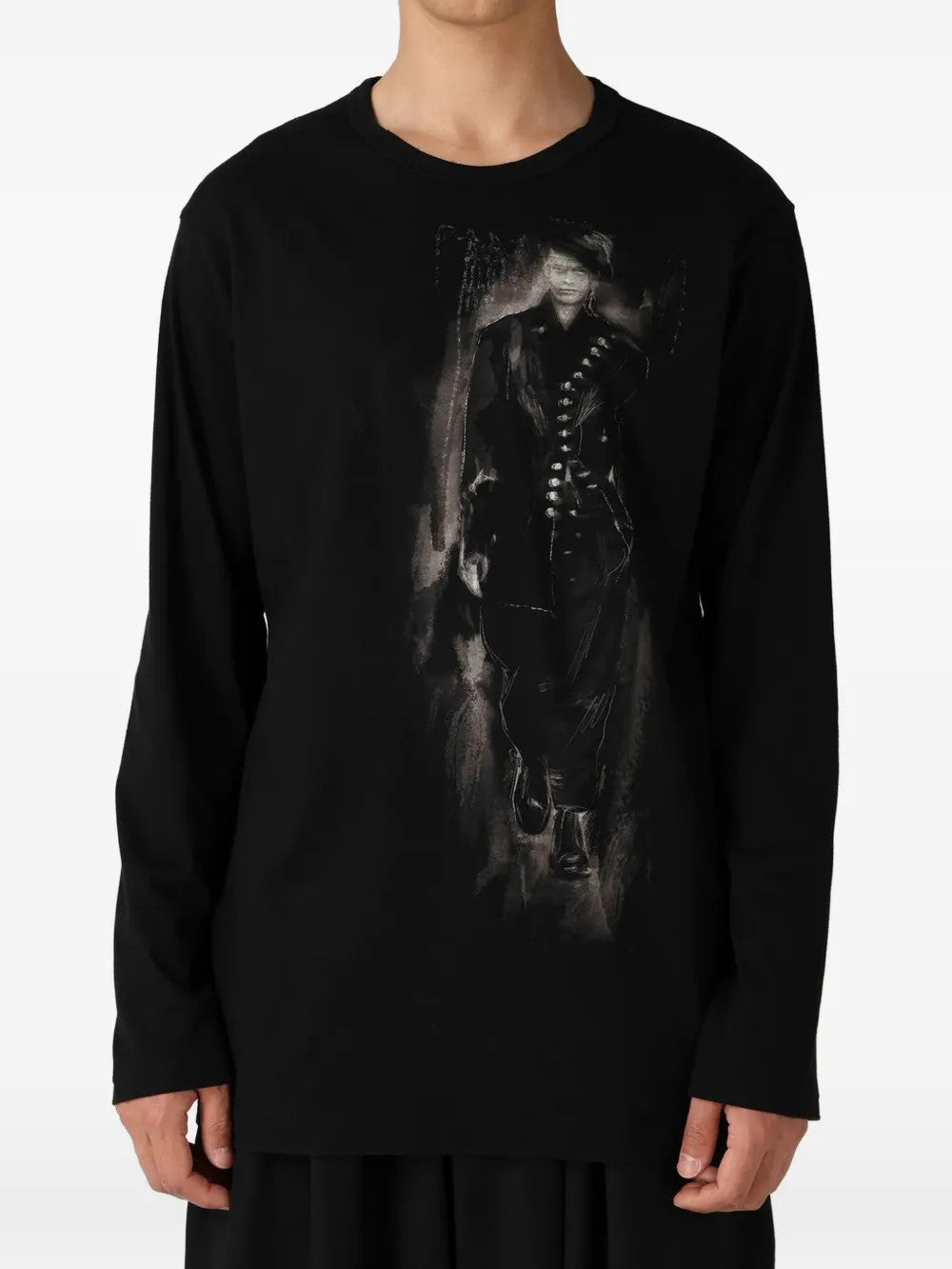 Black shirt worn by a person, showing the shirt fit
