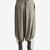 Tan pants worn by a person, showing the pants fit