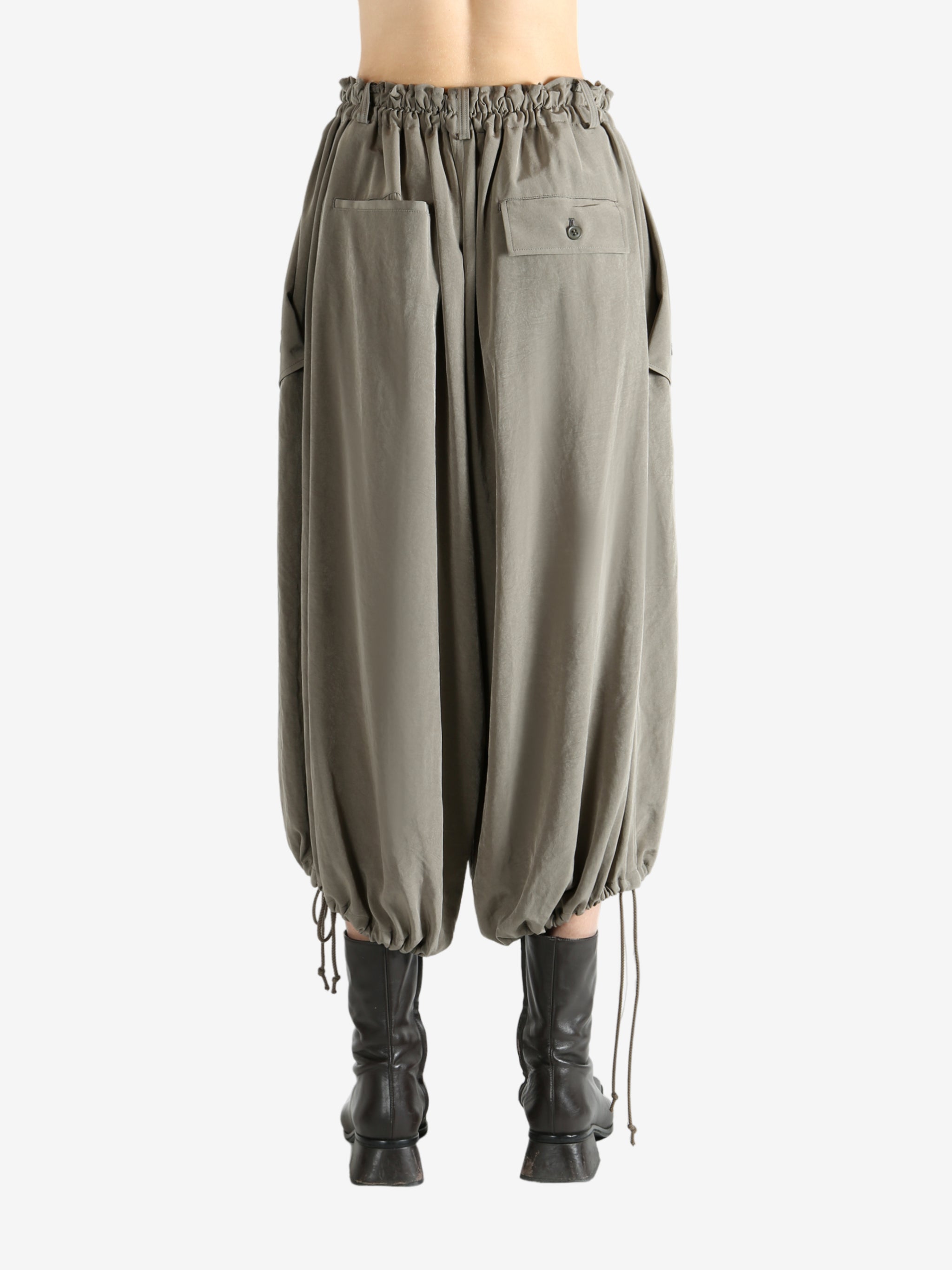 Tan pants worn by a person, showing the pants fit