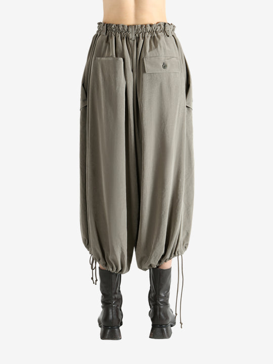 Tan pants worn by a person, showing the pants fit