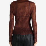 Brown shirt worn by a person, showing the shirt's fit