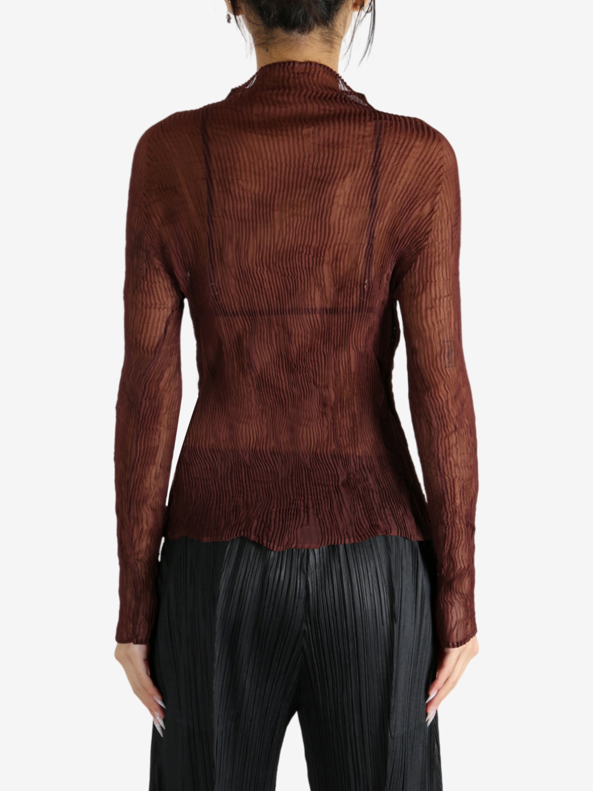 Brown shirt worn by a person, showing the shirt's fit