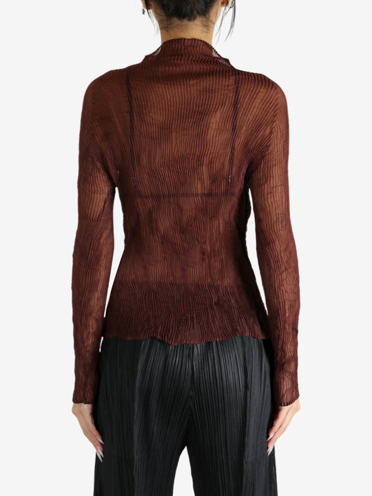 Brown shirt worn by a person, showing the shirt's fit