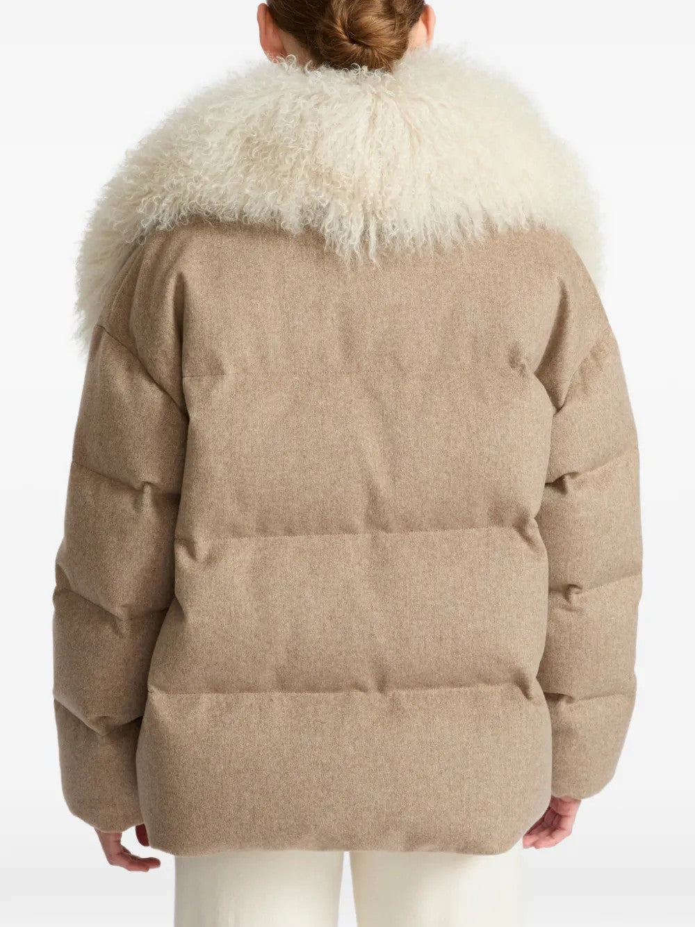 Tan jacket worn by a person, showing the jacket fit