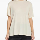 White t-shirts worn by a person, showing the t-shirts fit