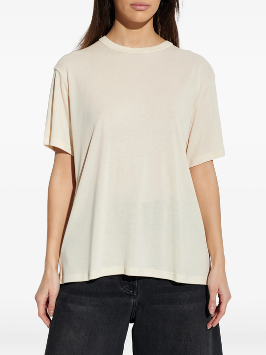 White t-shirts worn by a person, showing the t-shirts fit