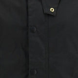 Close up of Black jacket, showing texture of the corduroy fabric