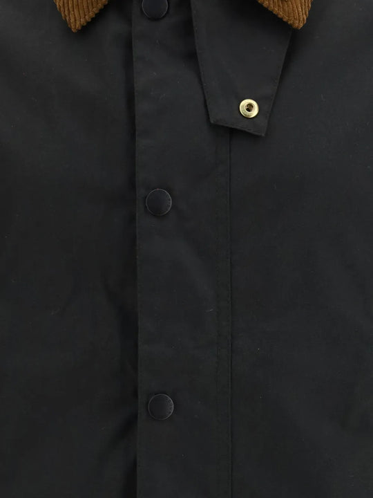 Close up of Black jacket, showing texture of the corduroy fabric