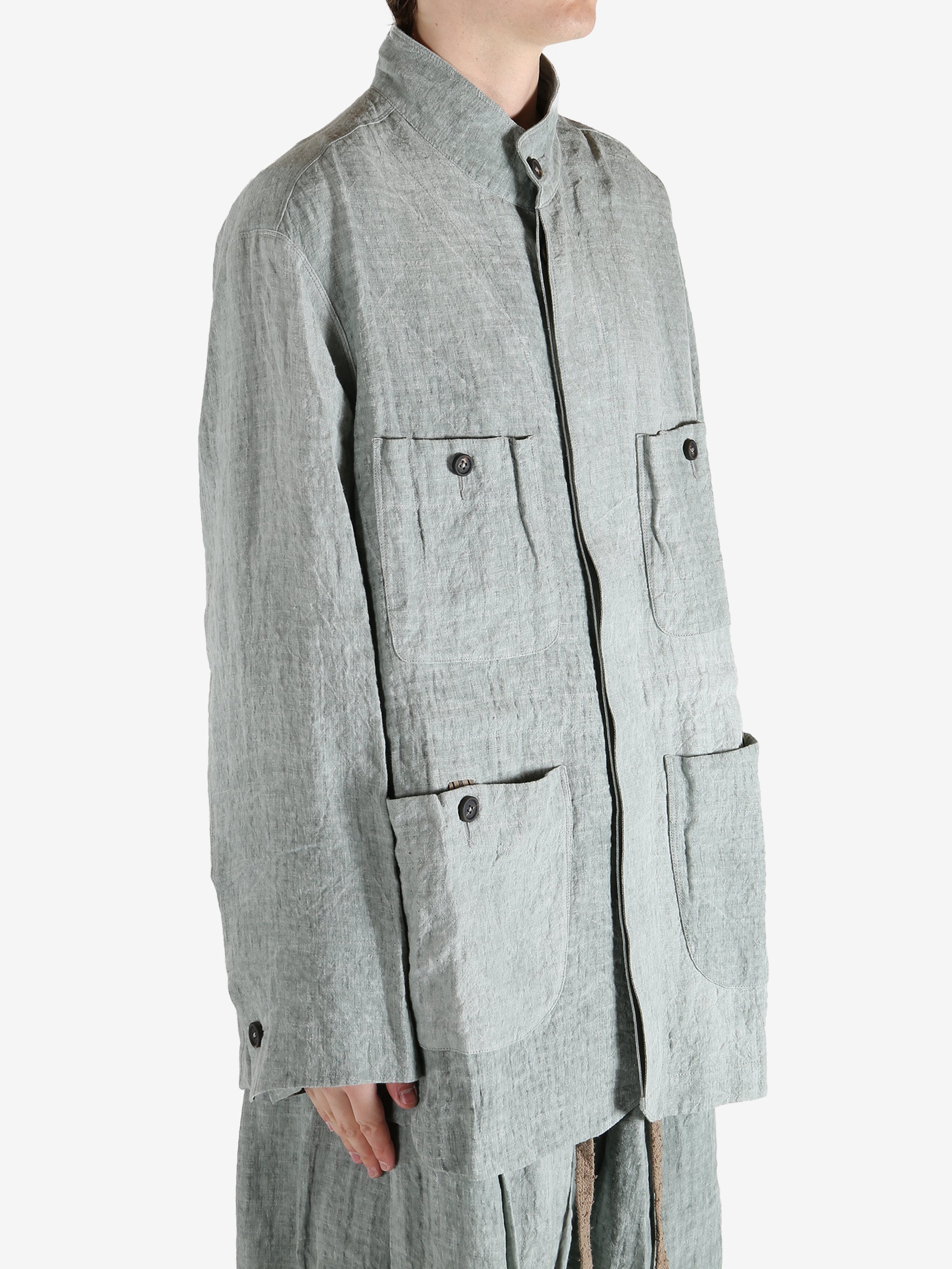 Grey jackets worn by a person, showing the jackets fit