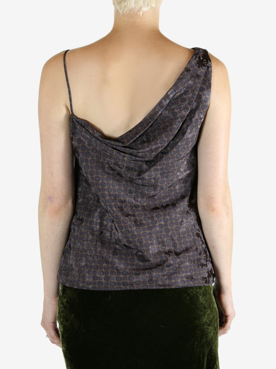 Brown top worn by a person, showing the top's fit