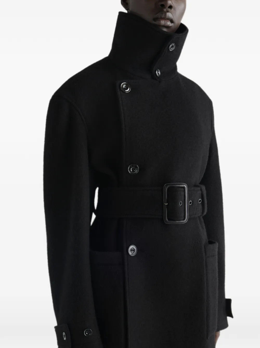 Black jacket worn by a person, showing the jacket fit