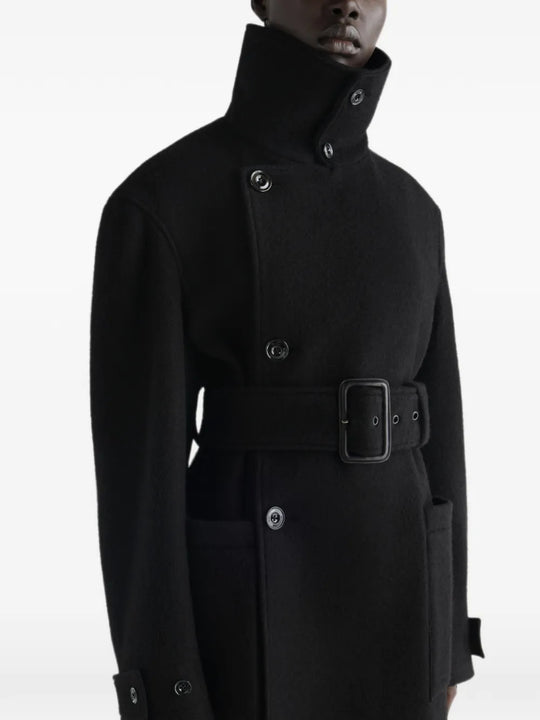 Black jacket worn by a person, showing the jacket fit