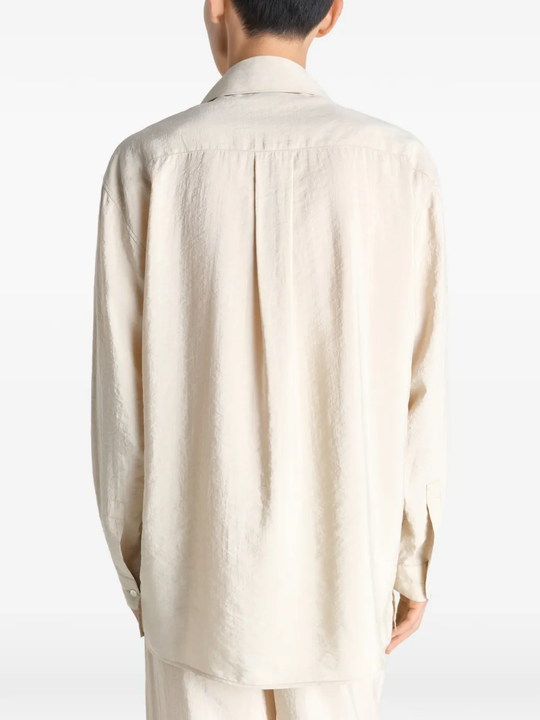 White shirts worn by a person, showing the shirts fit