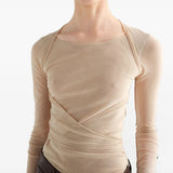 Tan top worn by a person, showing the top fit