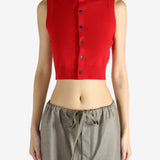 Red top worn by a person, showing the top's fit