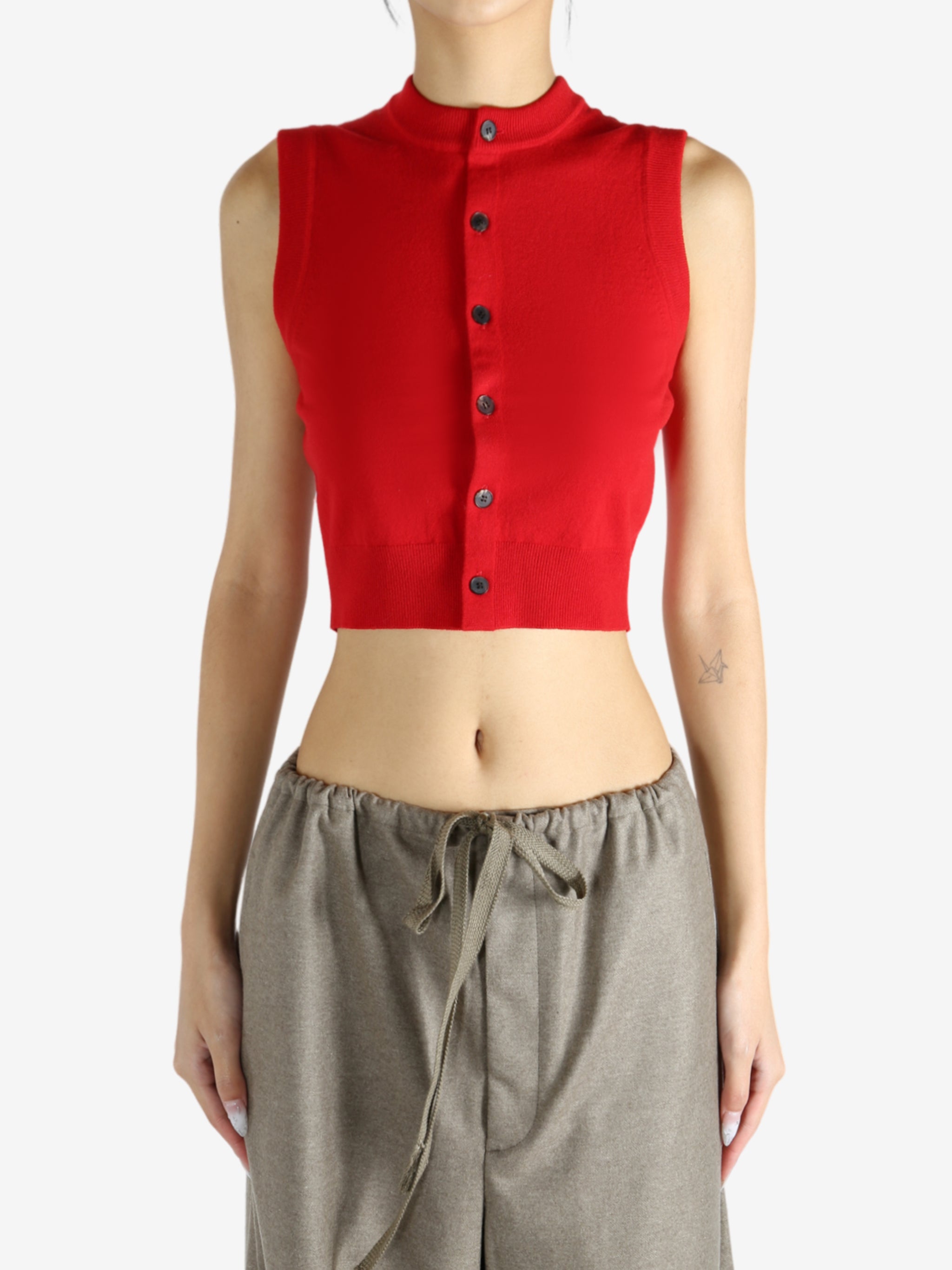 Red top worn by a person, showing the top's fit