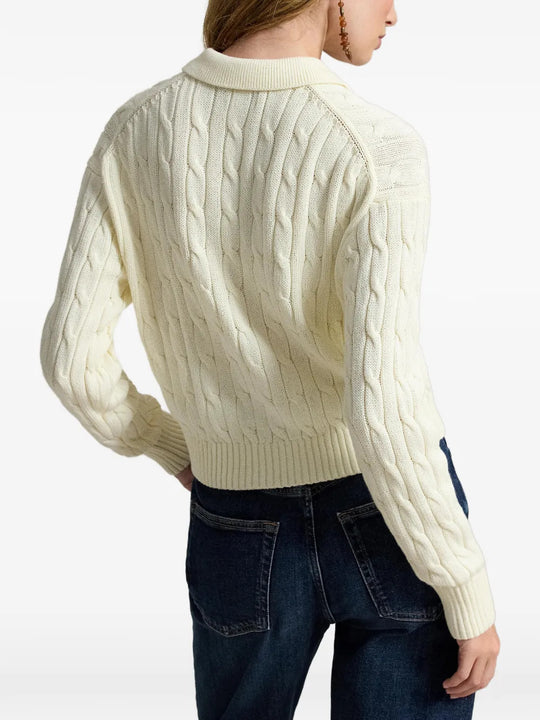 Tan knitwear worn by a person, showing the knitwear fit