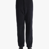 Navy pants worn by a person, showing the pants fit