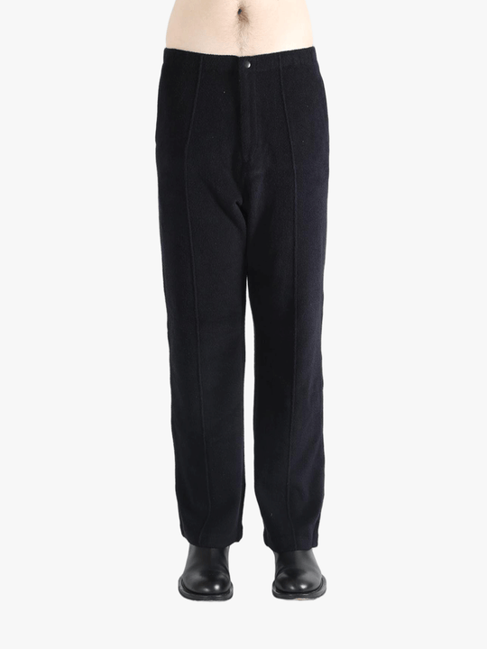 Navy pants worn by a person, showing the pants fit