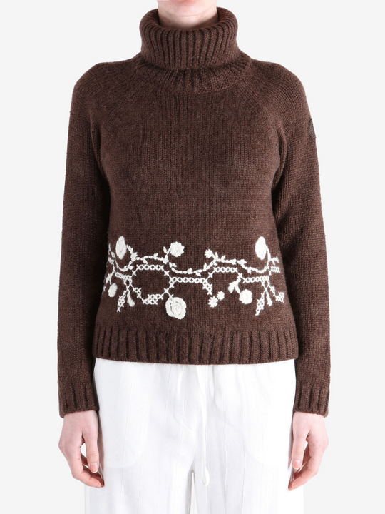 Brown knitwear worn by a person, showing the knitwear fit