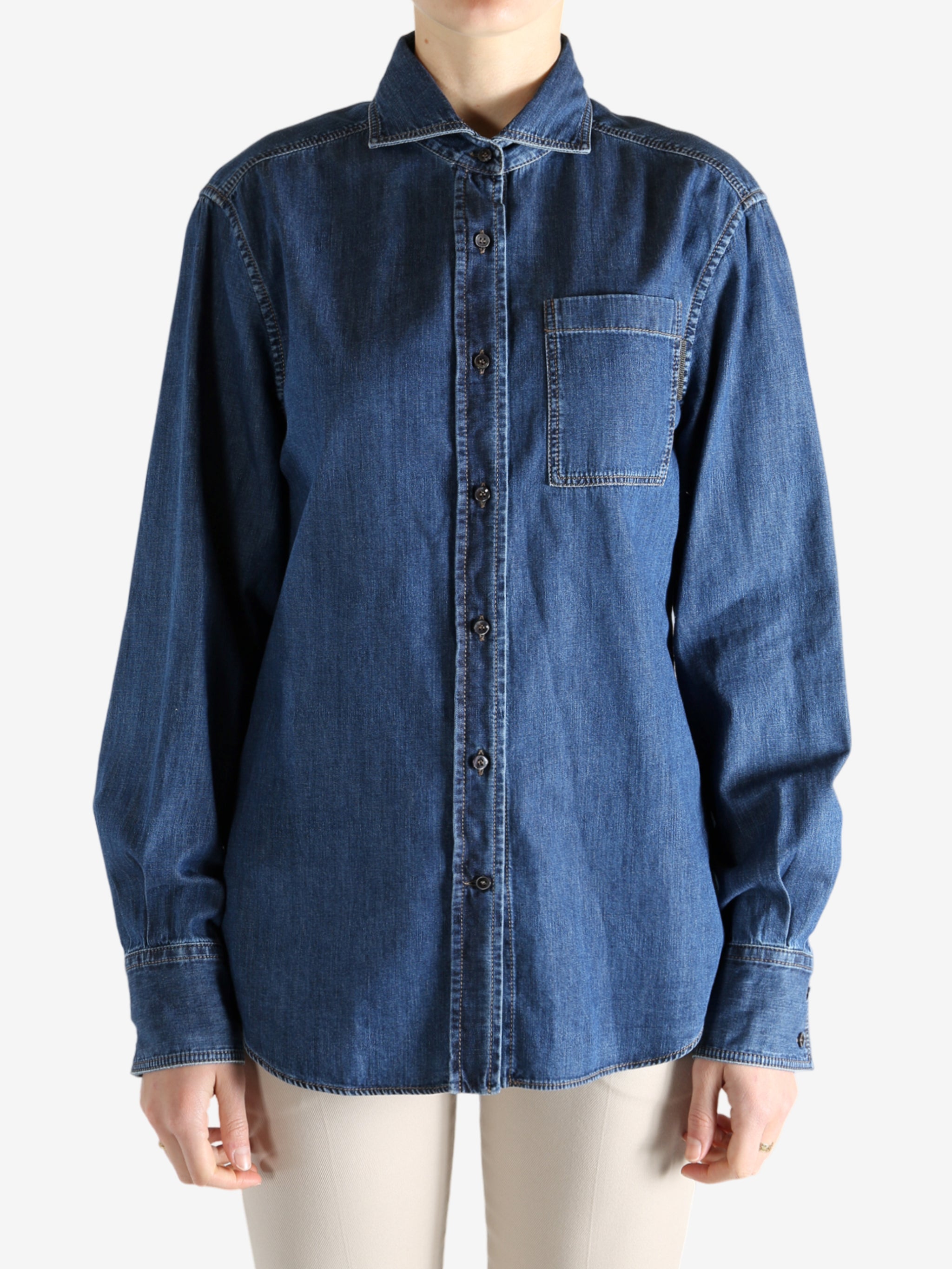 Blue jacket worn by a person, showing the jacket fit