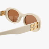 Close up of the brown sunglasses, showing texture of the acetate fabric