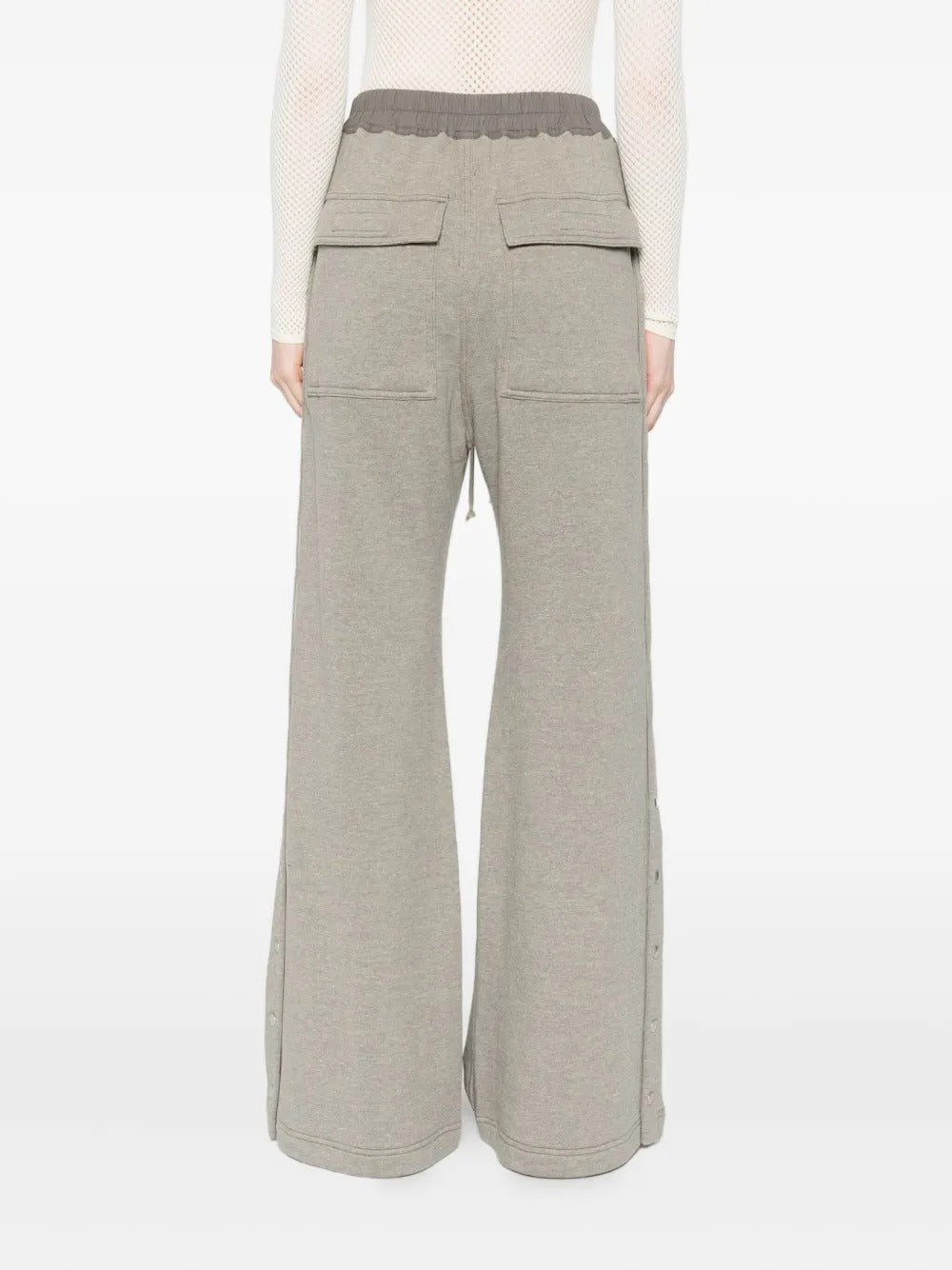 Grey pants worn by a person, showing the pants' fit