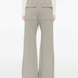 Grey pants worn by a person, showing the pants' fit