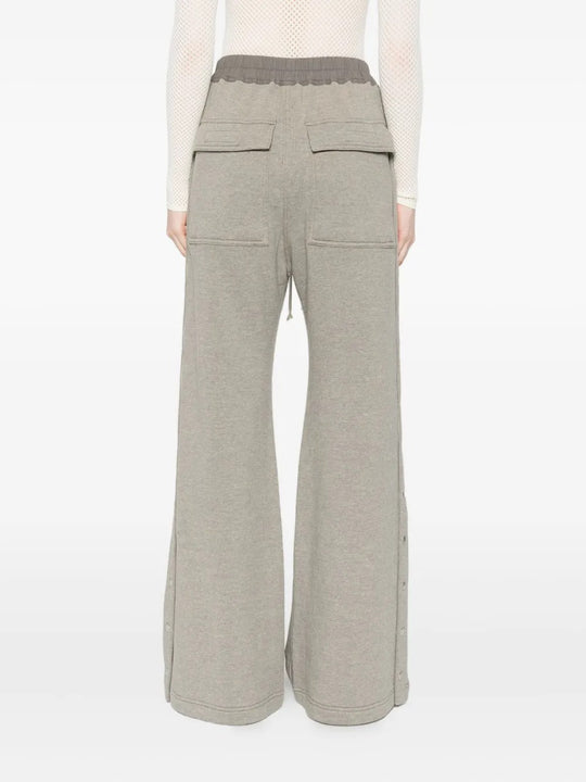 Grey pants worn by a person, showing the pants' fit