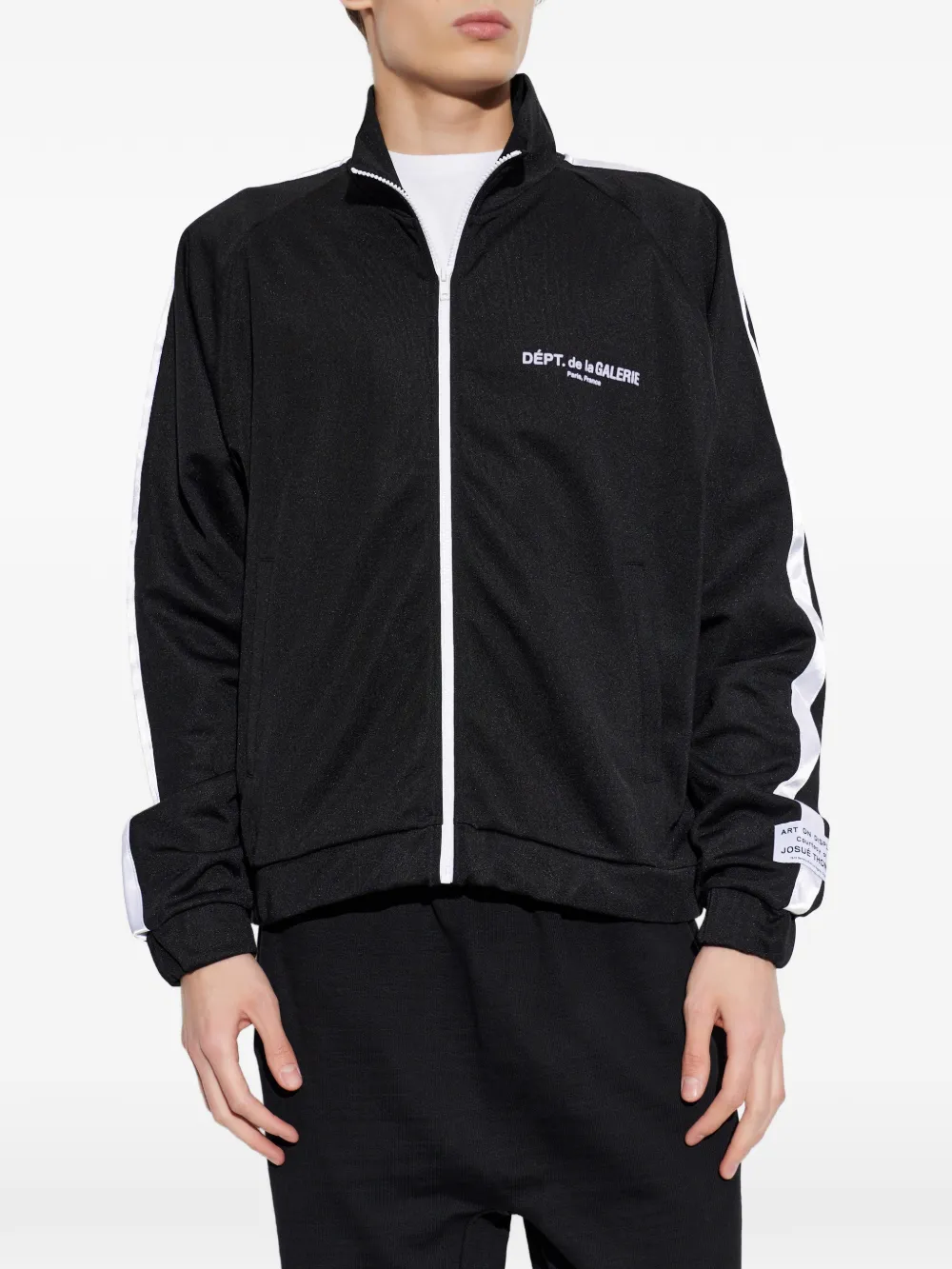 Black jacket worn by a person, showing the jacket fit