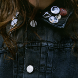 Close up of the grey jacket, showing texture of the cotton fabric