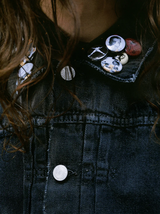 Close up of the grey jacket, showing texture of the cotton fabric
