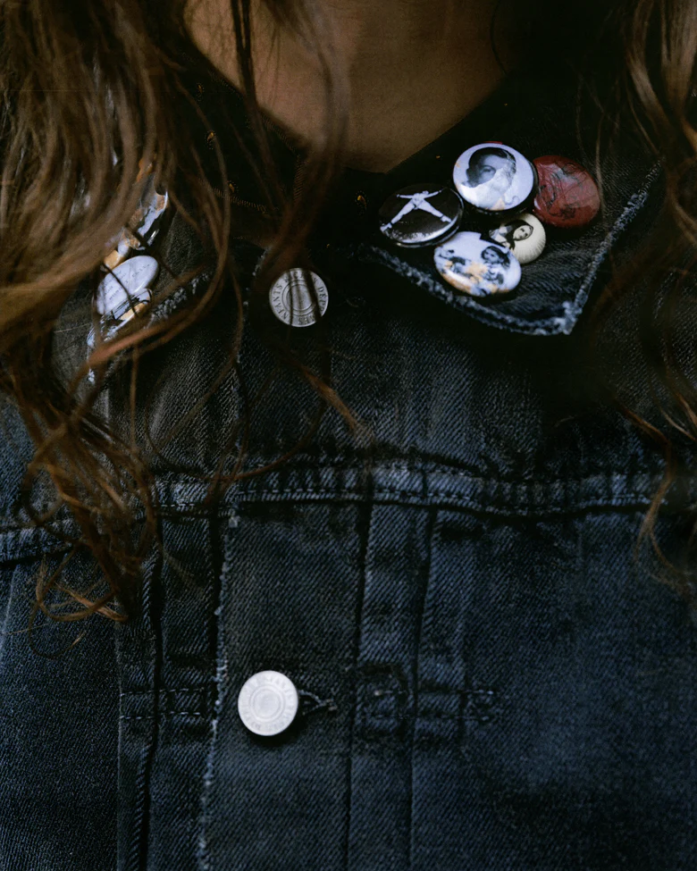 Close up of the grey jacket, showing texture of the cotton fabric