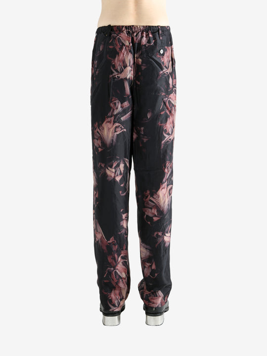 Black pants worn by a person, showing the pants' fit