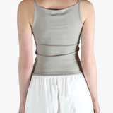 Grey tops worn by a person, showing the tops fit