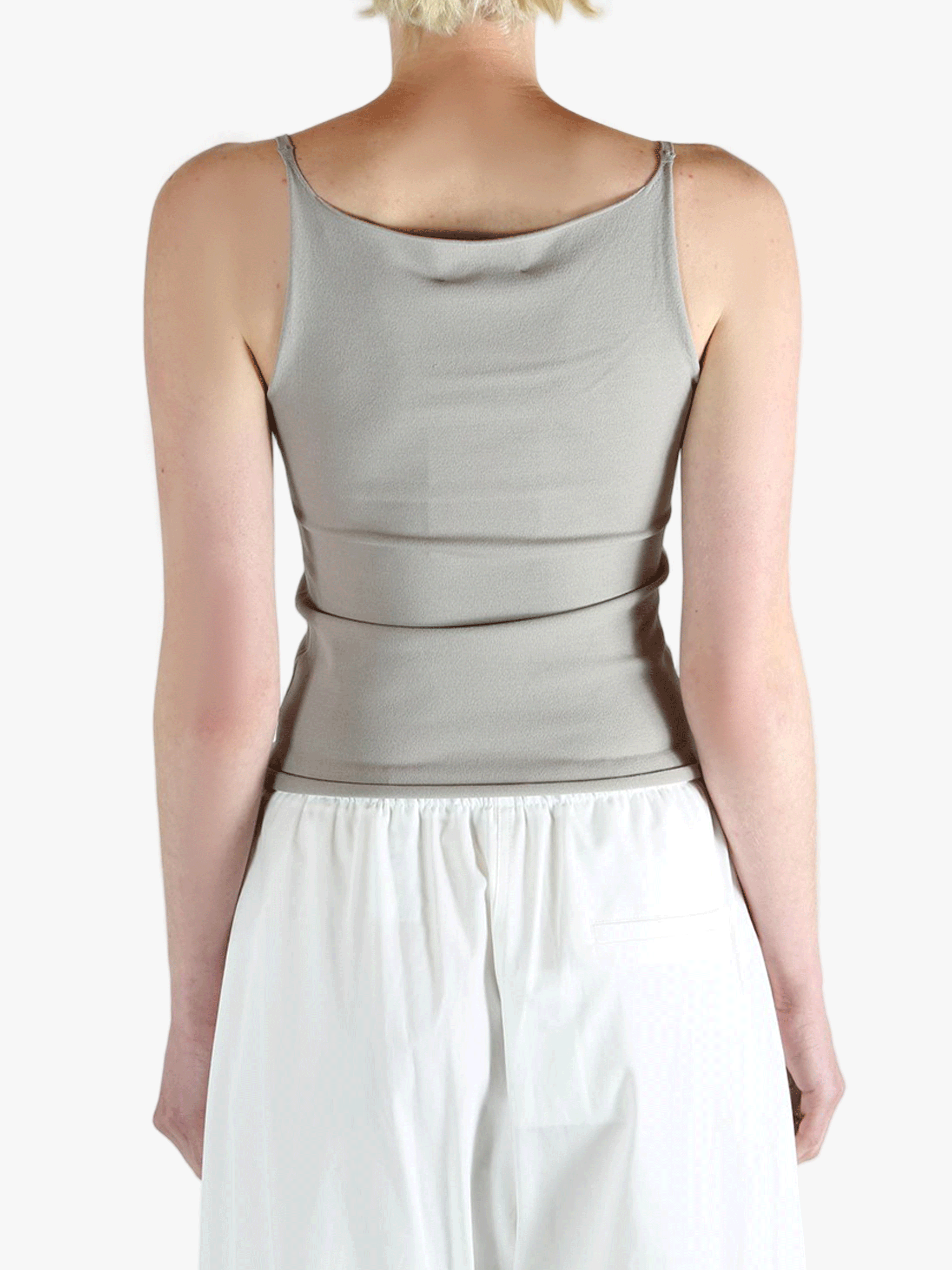 Grey tops worn by a person, showing the tops fit