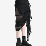 Black skirt worn by a person, showing the skirt fit