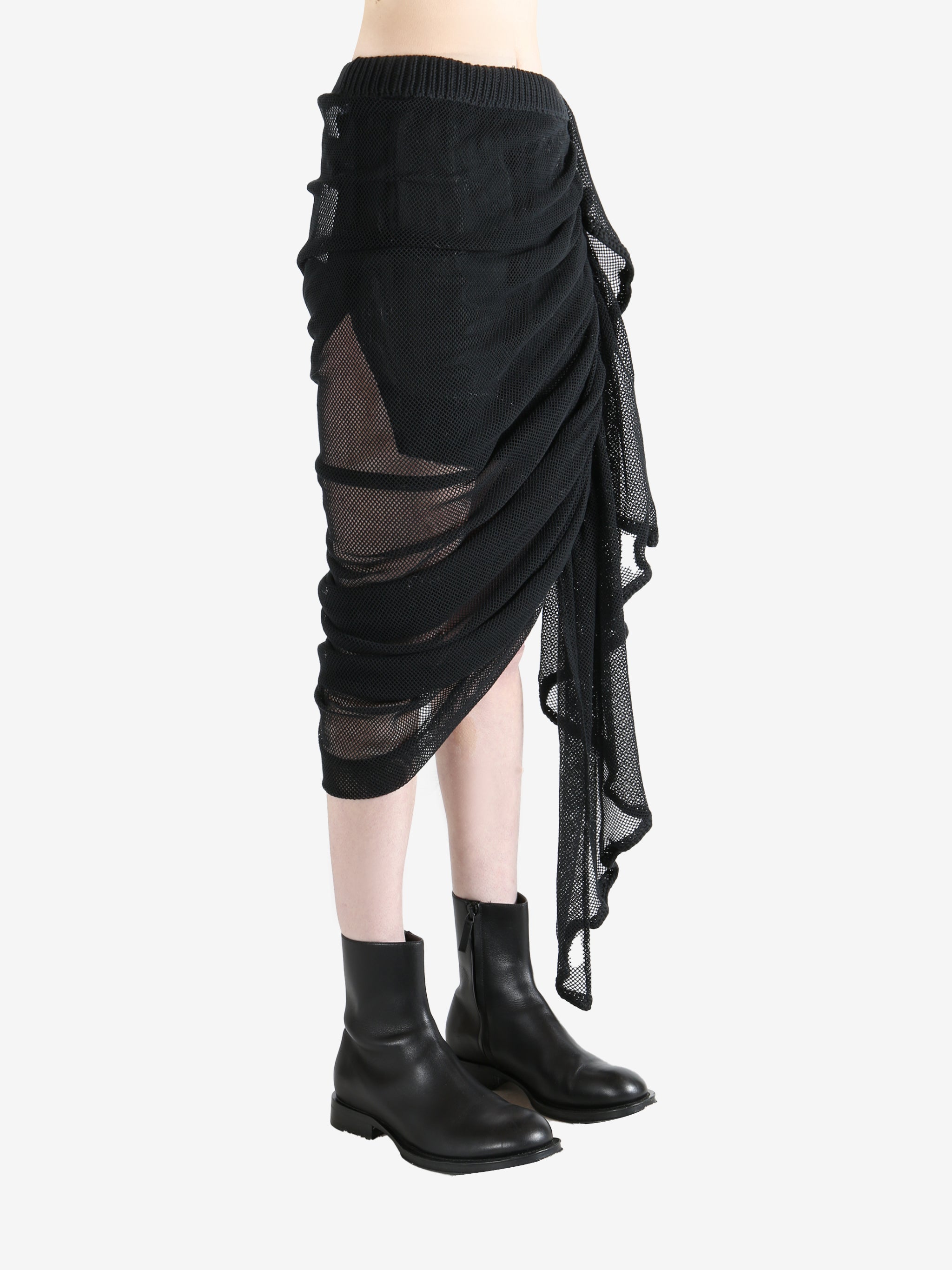 Black skirt worn by a person, showing the skirt fit