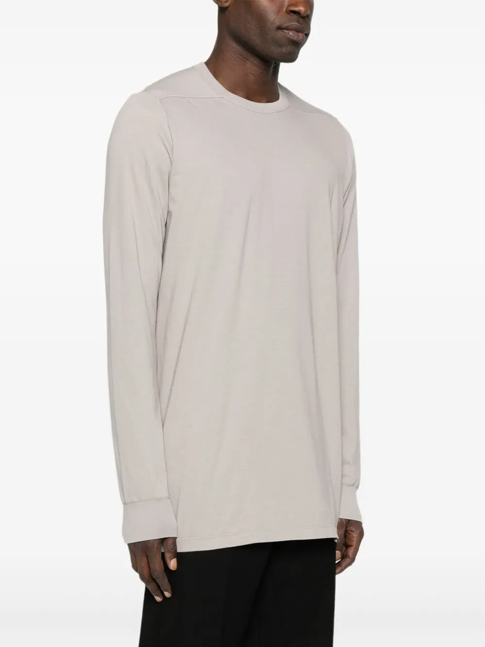 White t-shirt worn by a person, showing the shirt's fit