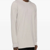 White t-shirt worn by a person, showing the shirt's fit