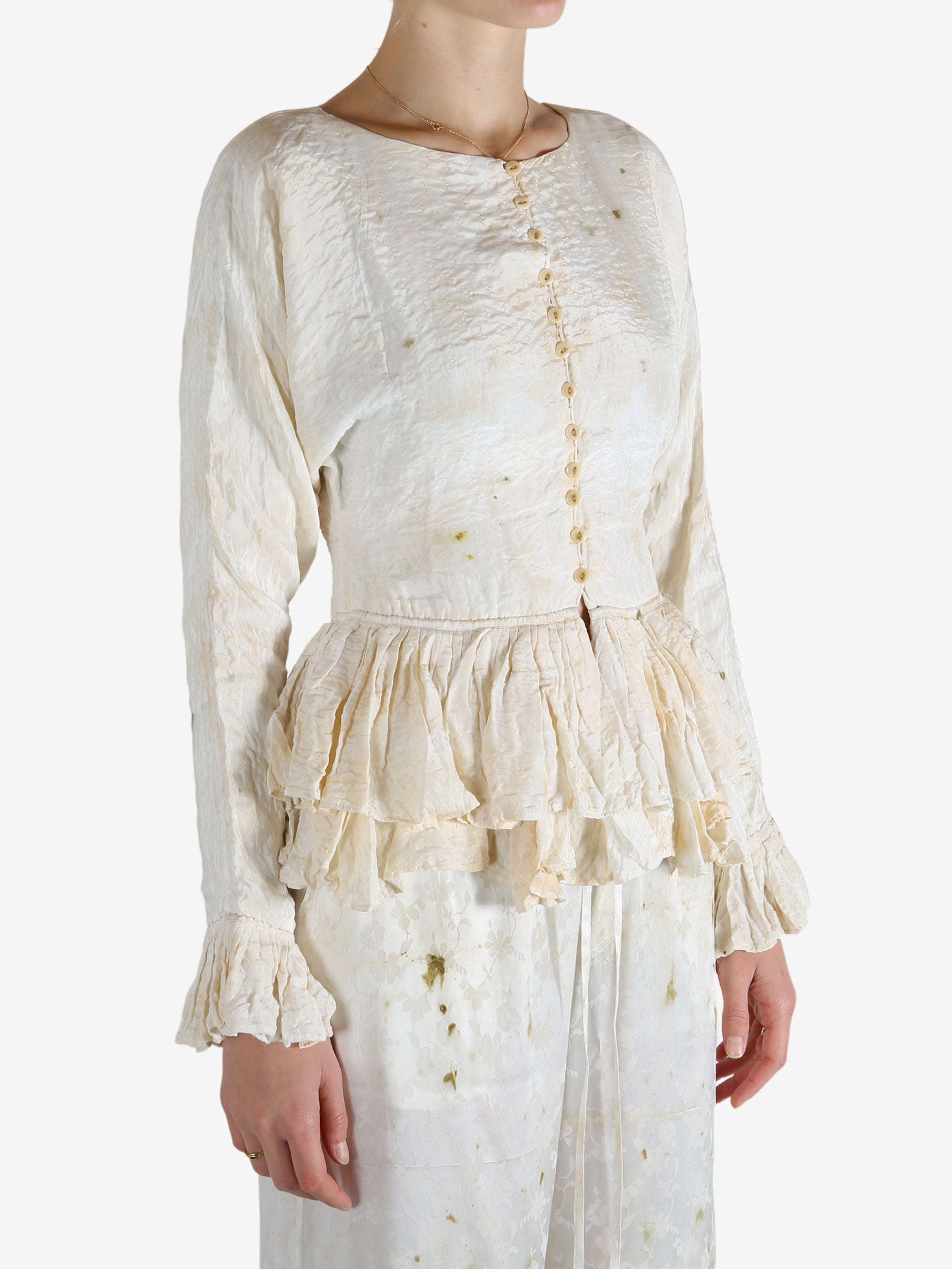 White tops worn by a person, showing the tops's fit