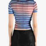 Blue t-shirt worn by a person, showing the shirt's fit