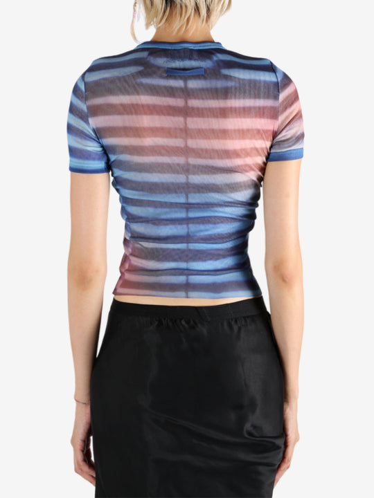 Blue t-shirt worn by a person, showing the shirt's fit