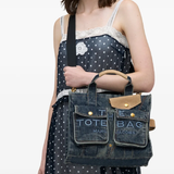 blue bags worn by a person, showing the bags fit