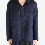 Blue jacket worn by a person, showing the jacket fit